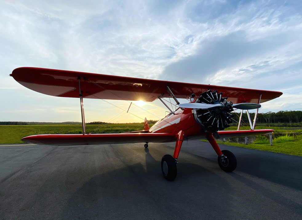 Stearman plane against a sunny backdrop