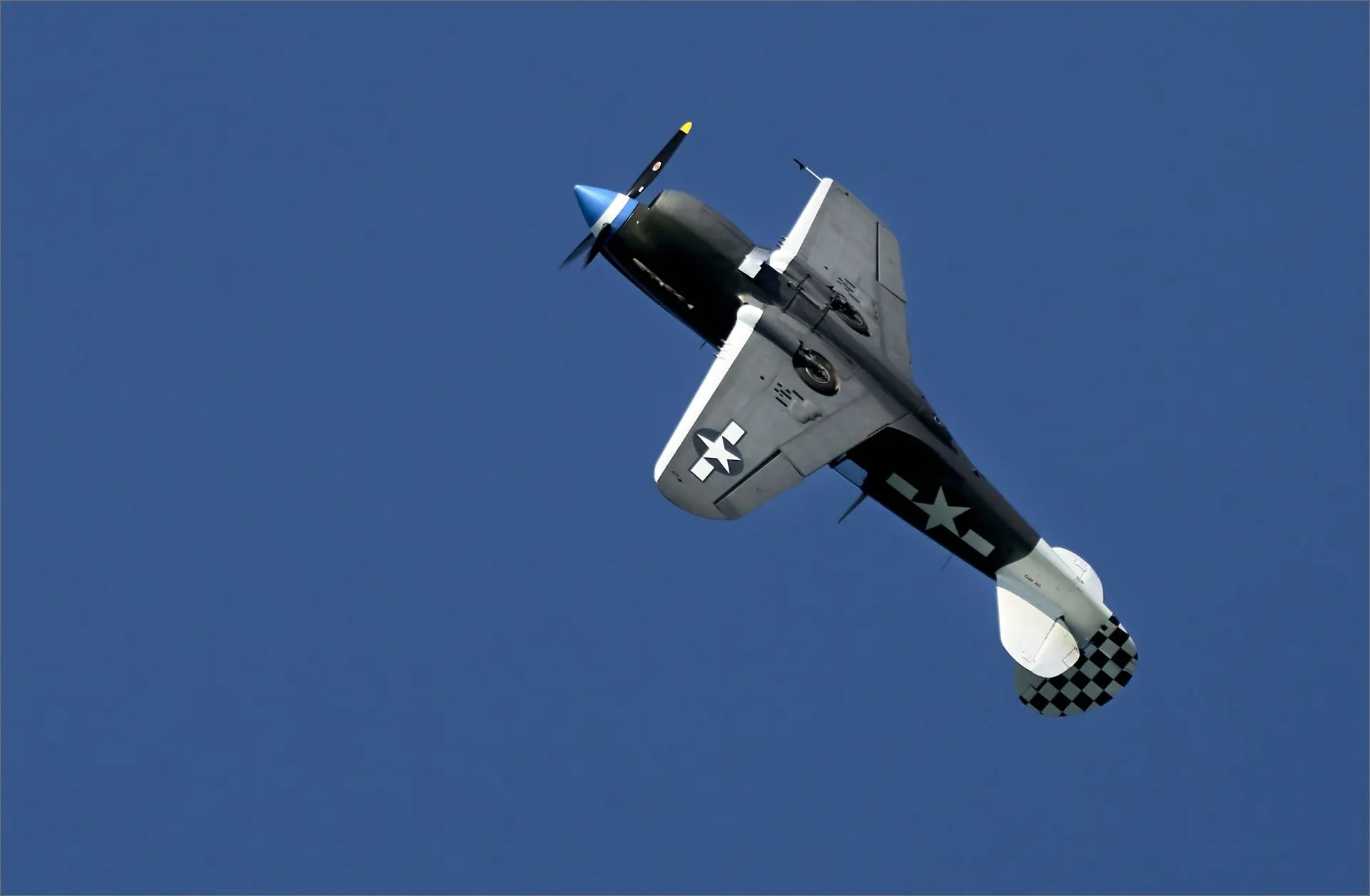 A Kittyhawk plane doing aerobatics